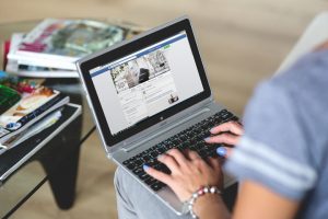 A woman working at her laptop at home
