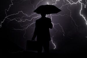 A business person weathering the storm