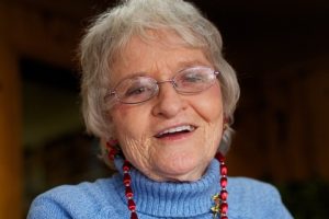 Older woman smiling. 