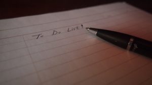 A paper and pen with the words written 'To Do list'
