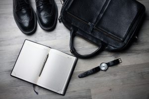 Briefcase, watch, journal, and dress shoes